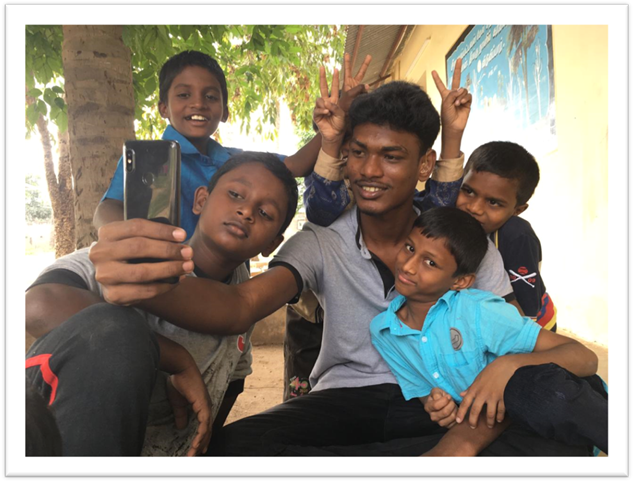 A group of people posing for the camera

Description automatically generated