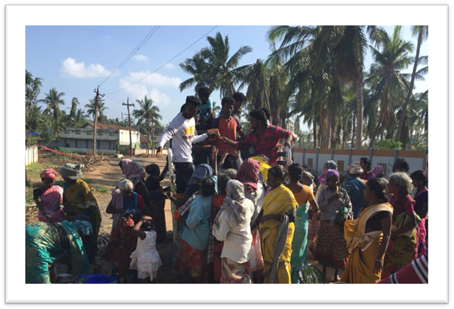 A group of people standing in front of a crowd

Description automatically generated